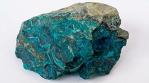copper ore from a copper mine in Chile, a green stone on a white background copper ore from a copper mine in Chile, a green stone on a white background