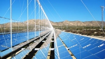 utility-scale solar power plant surrounded by mountains  utility-scale solar power plant surrounded by mountains