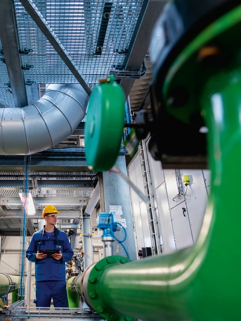 Production facility for the plant protectant Xemium at BASF's Ludwigshafen Verbund site. Xemium® belongs to the chemical class of carboxamides. BASF research teams have thus developed a high-performance active ingredient that helps farmers worldwide to control fungal diseases in various crops. These include for example soybean rust and septoria in cereals. The This highly efficient fungicide ensures consistently high yields for farmers. Plant operator Philipp Krämer during an inspection tour of the plant. He is using a mobile device, which for example generates maintenance messages on site.